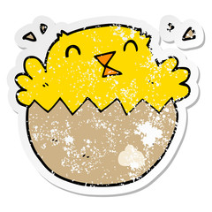 distressed sticker of a cartoon hatching chick
