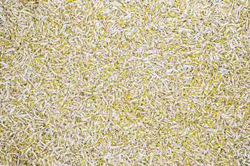 Plastic yellow and white granulated crumb at the plant for processing and casting products from domestic and industrial waste