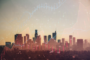 Trading graph on the cityscape at background. Business and financial concept. Double exposure. Los Angeles