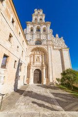 Fototapeta na wymiar facade of church in Monastery Santa Maria de la Vid, landmark and monument from twelfth century, in Burgos, Castile and Leon, Spain, Europe, vertical shot