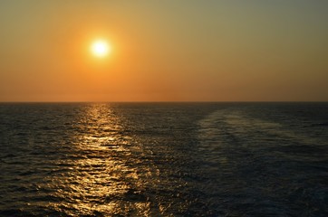 wake trail in the sunset