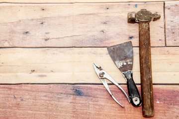 Tools for construction and repair on a wooden background