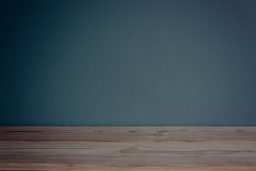 empty room with table and dark blue wall