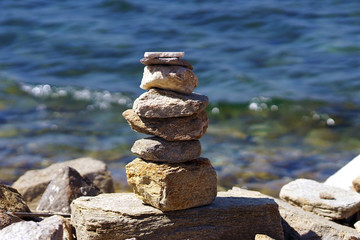 Beautiful compositions of marine stones made by tourists from all over the world