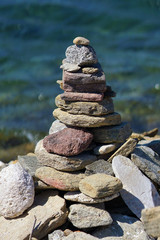 Beautiful compositions of marine stones made by tourists from all over the world