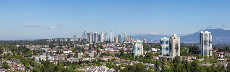 Fototapeta na wymiar Aerial view of a modern city during a sunny summer day. Taken in Burnaby, Vancouver, BC, Canada.