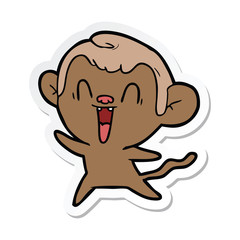 sticker of a cartoon laughing monkey