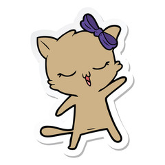 sticker of a cartoon cat with bow on head