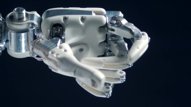White bionic prosthesis working, robotic hand.