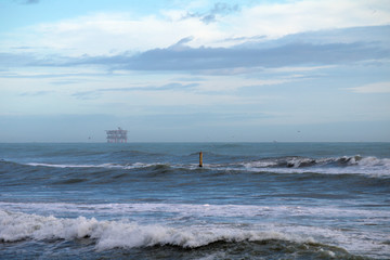 Fototapeta na wymiar platform for hydrocarbons,seascape,horizon,waves,clouds,view