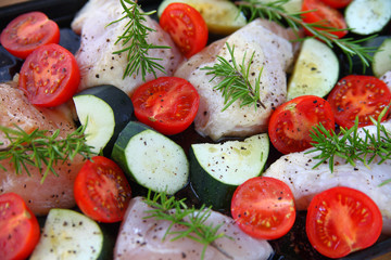 Zucchini, tomatoes and chicken ready to cook