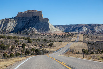 Scenic road in the desert during a vibrant sunny day. Taken on Route 12 near Cannonville, Utah, United States of America.