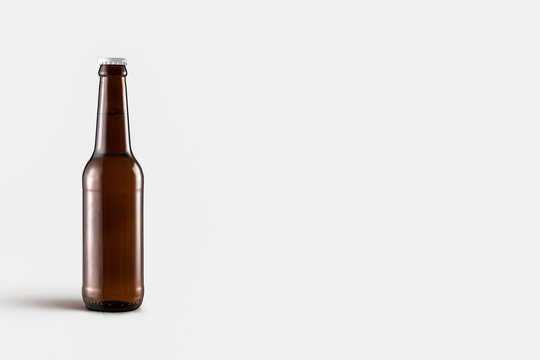 Beer Bottle Mock-Up isolated on soft gray background. Blank label.High resolution photo.