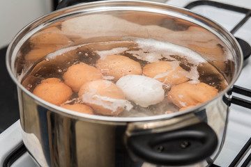 cooking Eggs in boiling water in pan Top view