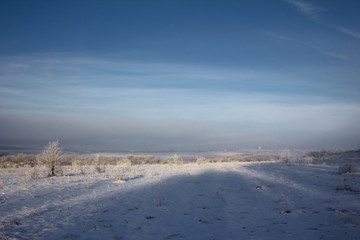 Fototapeta na wymiar winter landscape with blue sky and clouds