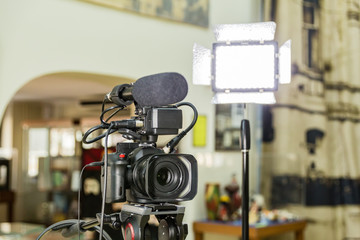 Shooting a report in the interior. Video equipment: camera, on-camera microphone gun, led lighting...