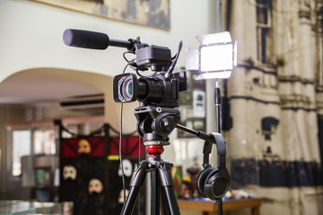 Shooting a report in the interior. Video equipment: camera, on-camera microphone gun, led lighting...