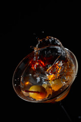 Martini cocktail with green olives.