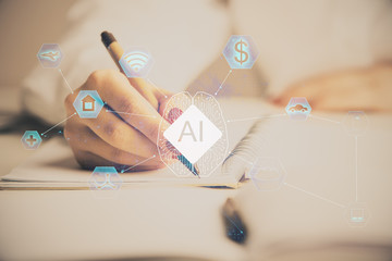 AI (Artificial Intelligence) concept. deep learning. Double exposure hands writing pad background.