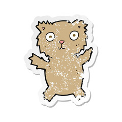 Fototapeta premium retro distressed sticker of a cartoon teddy bear