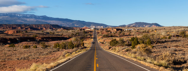 Scenic road in the desert during a vibrant sunny sunrise. Taken on Route 24 near Torrey, Utah, United States of America. © edb3_16