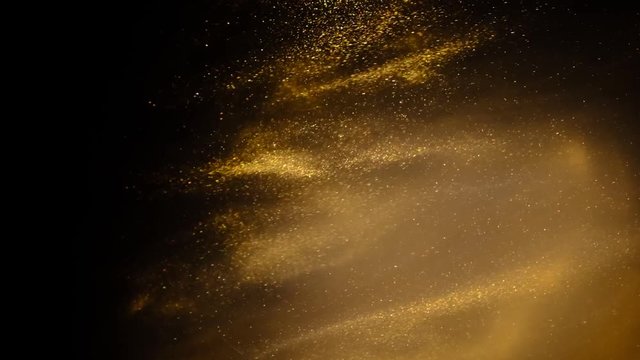 Golden sand or dust creating abstract cloud formations. Art backgrounds.