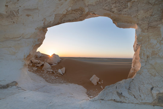 Sunset landscape with chalck rock formations at the White desert national park in Egypt
