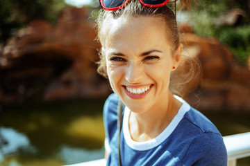 happy solo traveller woman having picturesque river cruise