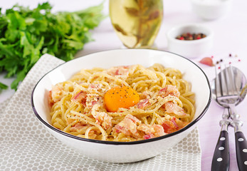 Classic homemade carbonara pasta with pancetta, egg, hard parmesan cheese and cream sauce. Italian cuisine. Spaghetti alla carbonara.