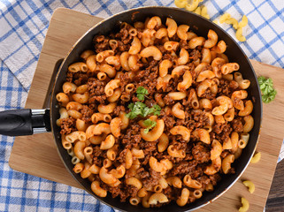Top .view. Pasta with ground beef and tomato paste in a pan