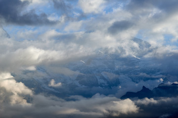 Fototapeta na wymiar Cloudy view of the mountains in Lauterbrunnen valley in Switzerland.