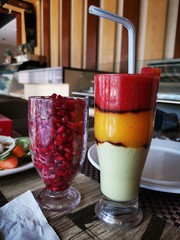 glass of juice on wooden table