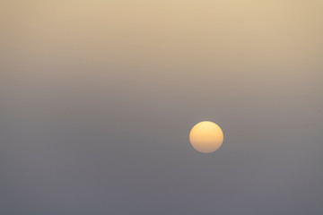 Sunrise in the White Desert National Park in Egypt the morning after a sandstorm