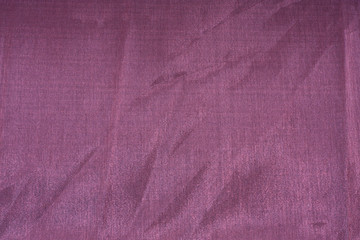 closeup photo of a purple, silky, satin background