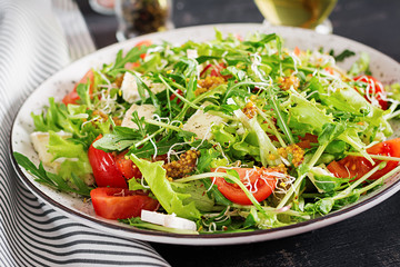 Tomato salad with mix micro greens and  camembert cheese.