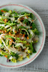Sweet Kale salad - healthy vegetarian salad with cabbage, eggs, greens, carrots and mayonnaise.