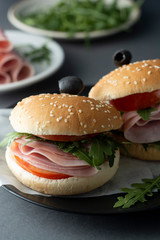 Hamburger with ham. Two burgers, hoemmade food. healthy sandwich with fresh vegetables.