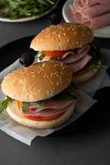 Hamburger with ham. Two burgers, hoemmade food. healthy sandwich with fresh vegetables.