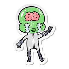 distressed sticker of a cartoon big brain alien crying and giving peace sign