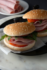 Hamburger with ham. Two burgers, hoemmade food. healthy sandwich with fresh vegetables.