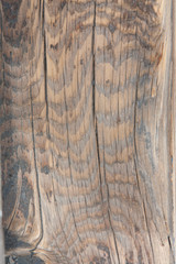 Vertical photo of a brown wood grain background/backdrop with wavy grain