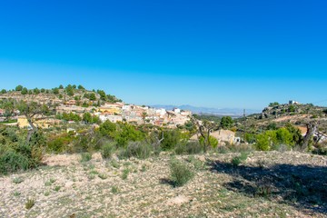 Fototapeta na wymiar A small village nestled in the dry hills of southern Spain