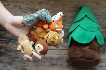 Fingers toys. Funny animals puppets in the fingers. Children's activities concept. Happy theatrical...