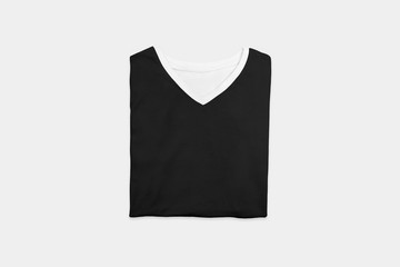 Folded Blank Black T-Shirts Mock-up on soft gray background, front view. Ready to replace your design.
