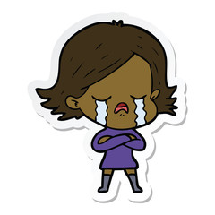sticker of a cartoon girl crying