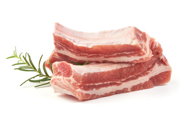 Fresh raw lamb ribs with rosemary, close-up, isolated on white background