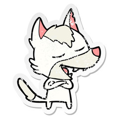 distressed sticker of a cartoon wolf laughing