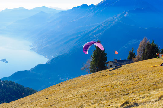 Paragliders on the Cardada-Cimetta Mountain range
