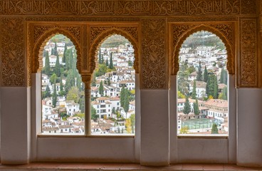 The view from an islamic palace in Granada, Spain, showing the white houses and buildings of the medieval city below. 
