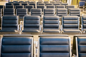 Waiting area in the airport gate, rows of empty chair at airport